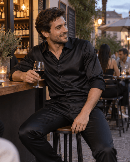 Black men’s matching shirt and trousers set at an evening wine bar